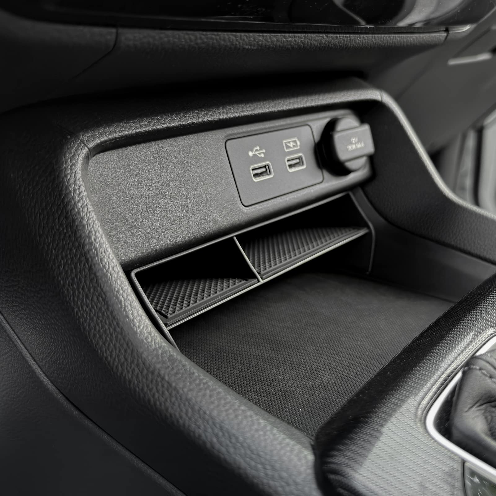 Cable and device storage kept neatly in Civic center console