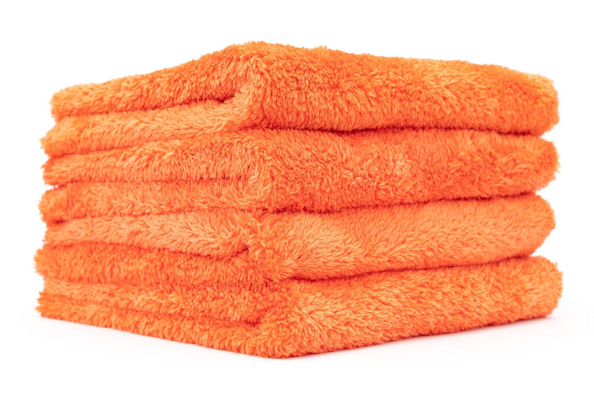 The Rag Company Eagle Edgeless orange towel folded for storage.