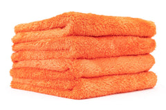 The Rag Company Eagle Edgeless orange towel folded for storage.