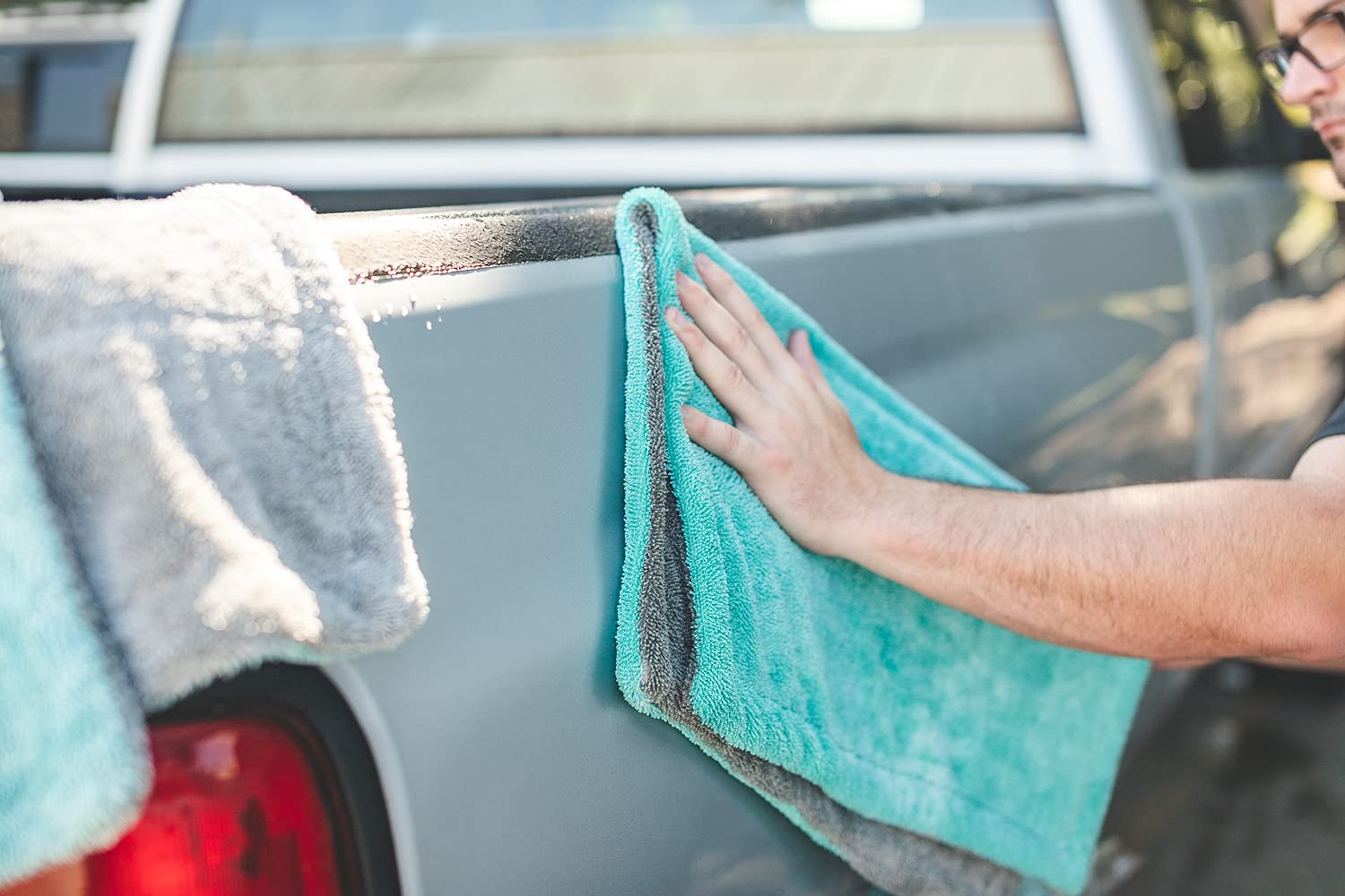 Liquid8r in action during a car wash illustrating scratch-free drying results.