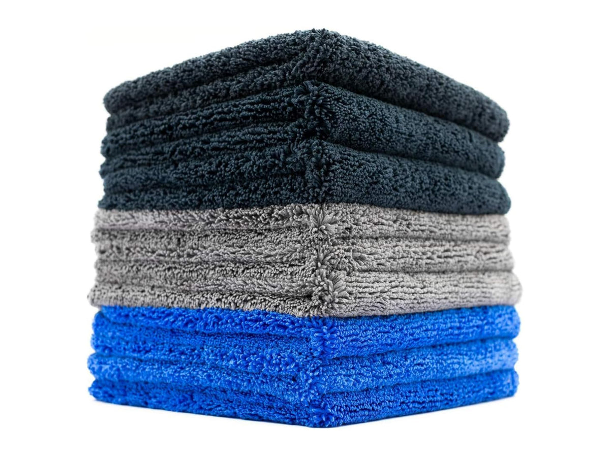 The Rag Company Spectrum 420 Dark Pack towels stacked for car detailing and drying.