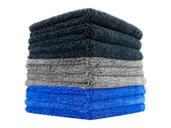 The Rag Company Spectrum 420 Dark Pack towels stacked for car detailing and drying.