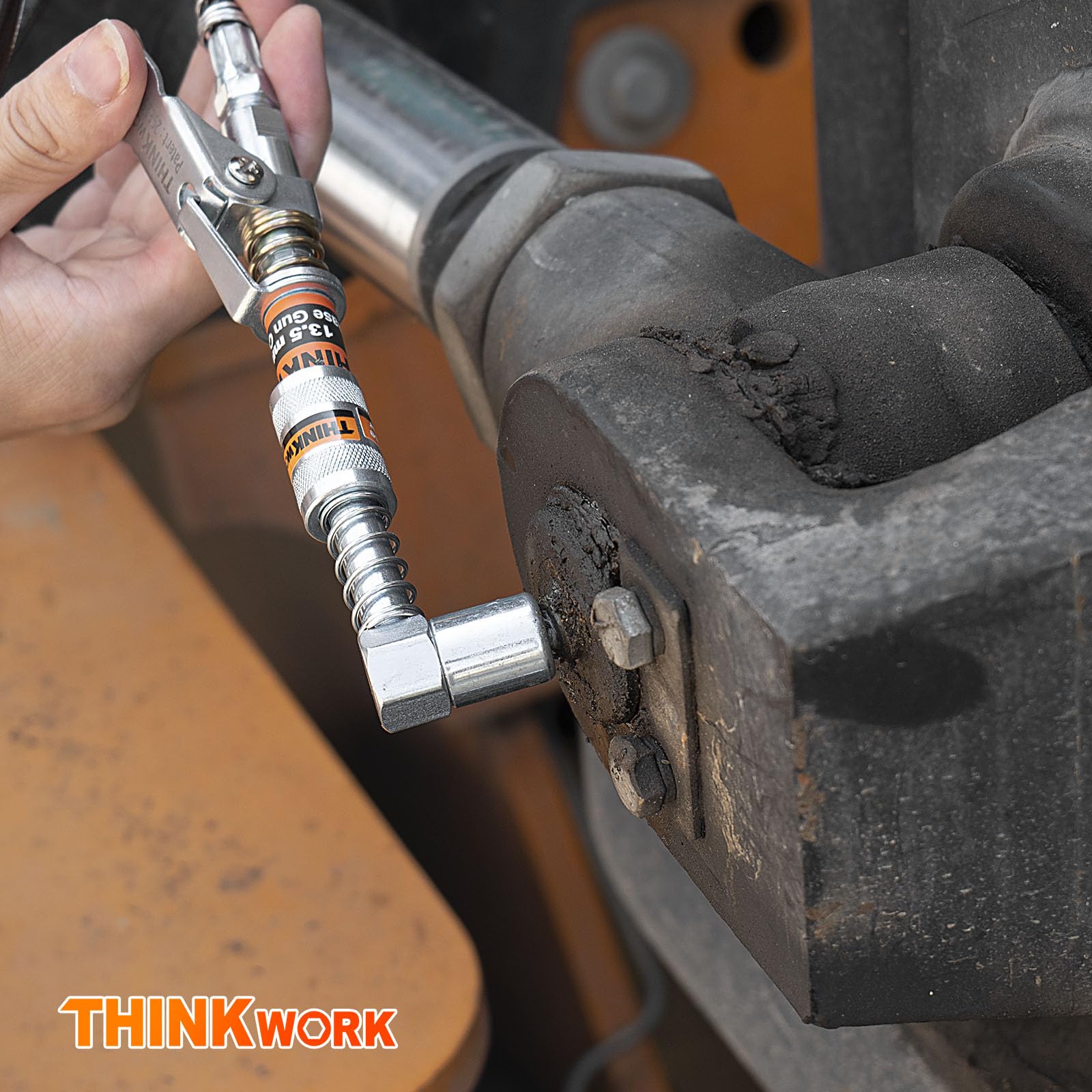 THINKWORK 12-inch spring hose extends reach during lubrication tasks