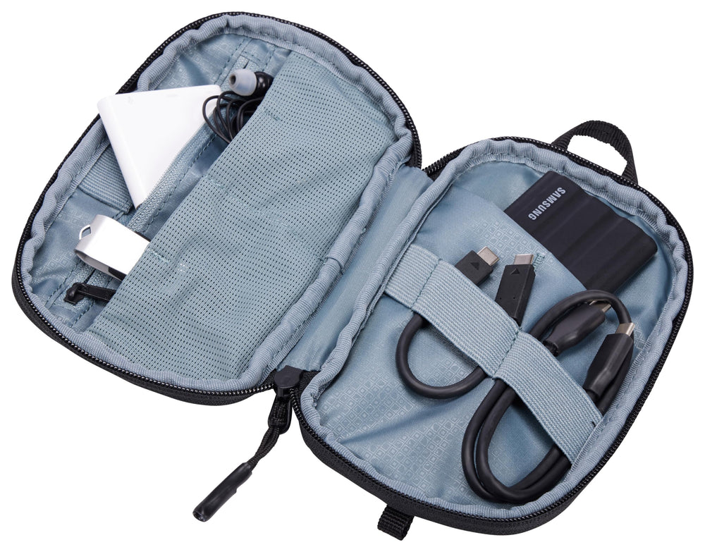 Thule Subterra PowerShuttle elastic loops securing chargers and earbuds during transit