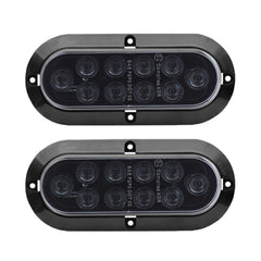 TMH 6-inch oval smoked lens red LED trailer tail light front view, durable waterproof design.