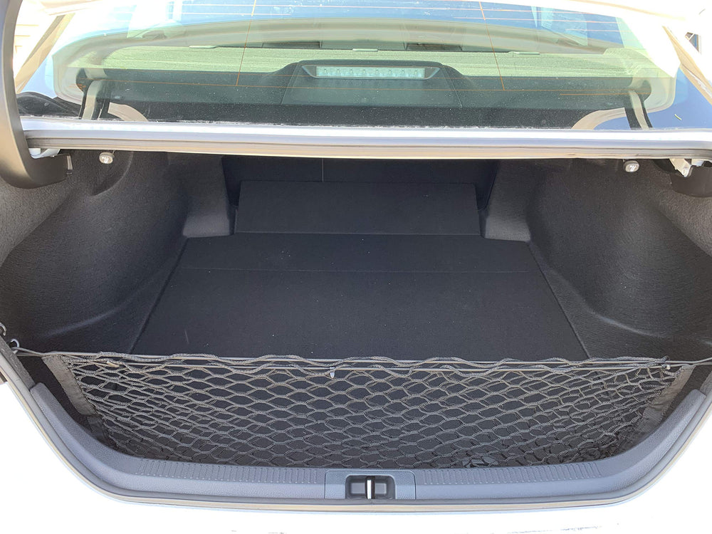 TN TrunkNets Camry groceries secured in trunk net during shopping trips.