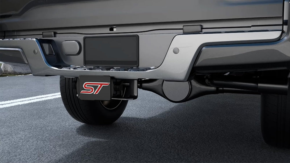 Rear vehicle with TOEASYTY hitch cover enhancing sport identity.