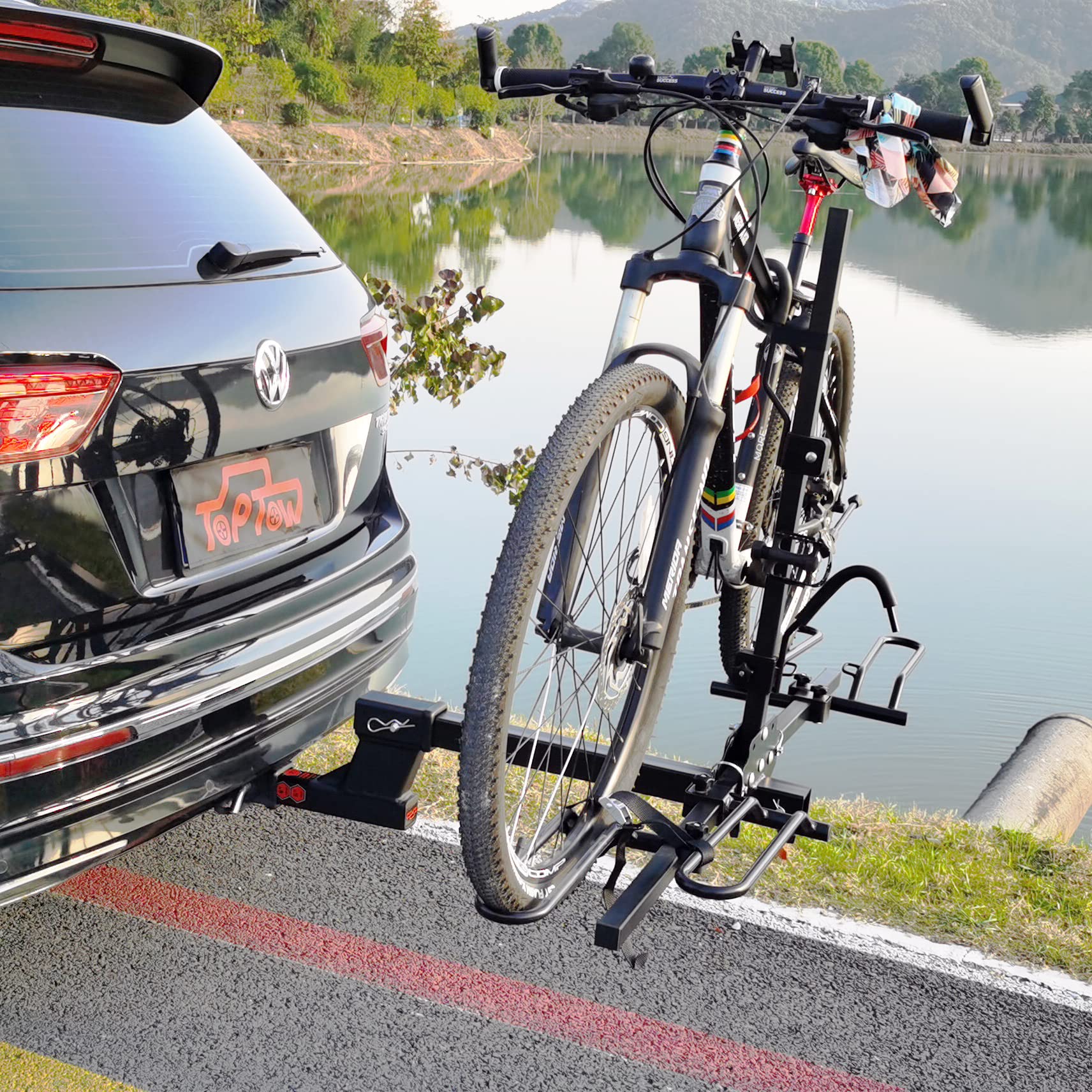TOPTOW towing setup with boat or bike rack shows versatile accessory compatibility.