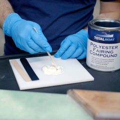 TotalBoat Polyester Fairing Compound feathered edge demonstrates easy sanding and paint-ready result.