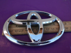 Toyota back-door emblem install-ready, genuine badge replacement for Camry models.