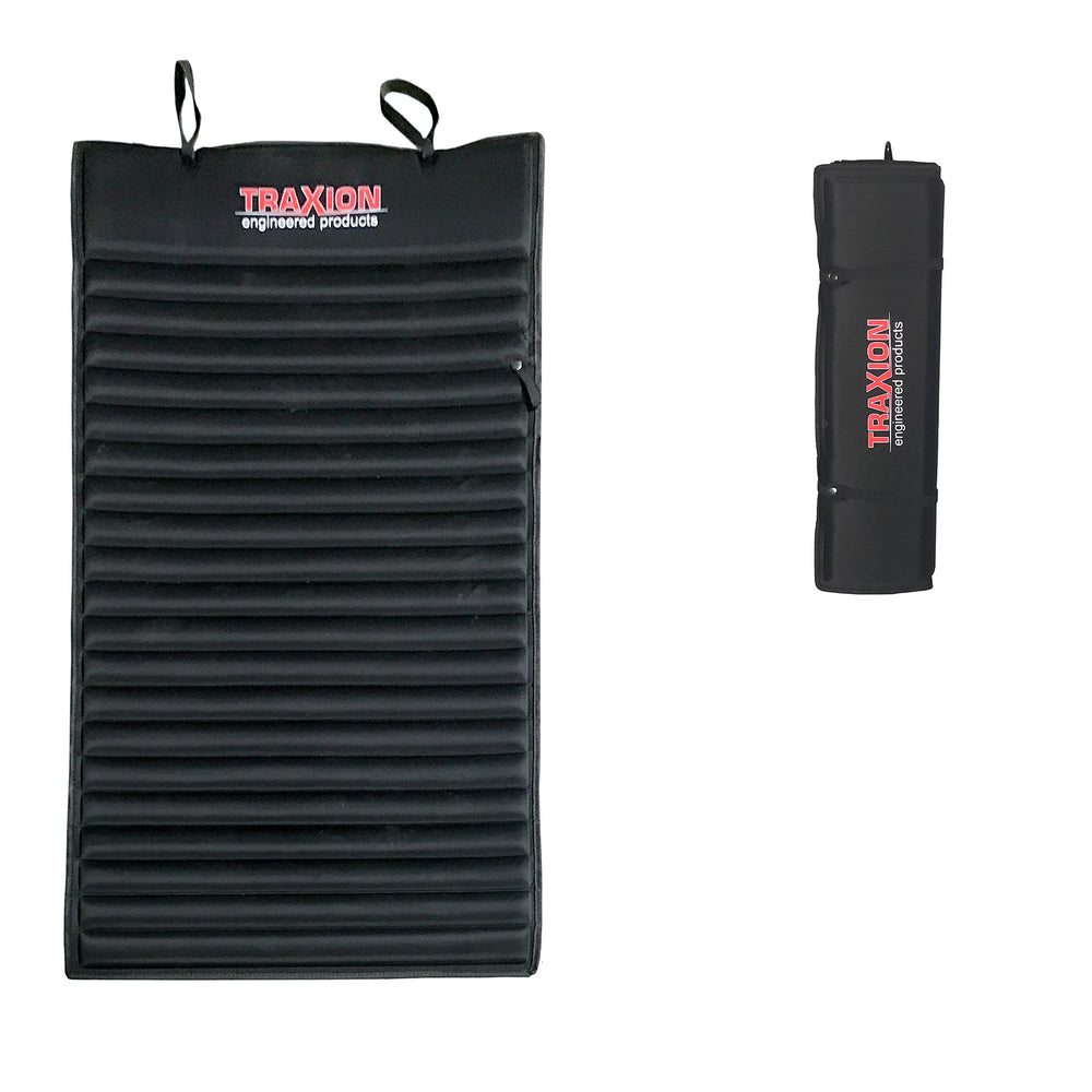 Traxion VersaMat roll-up foam pad provides cushioned kneeling support on concrete.