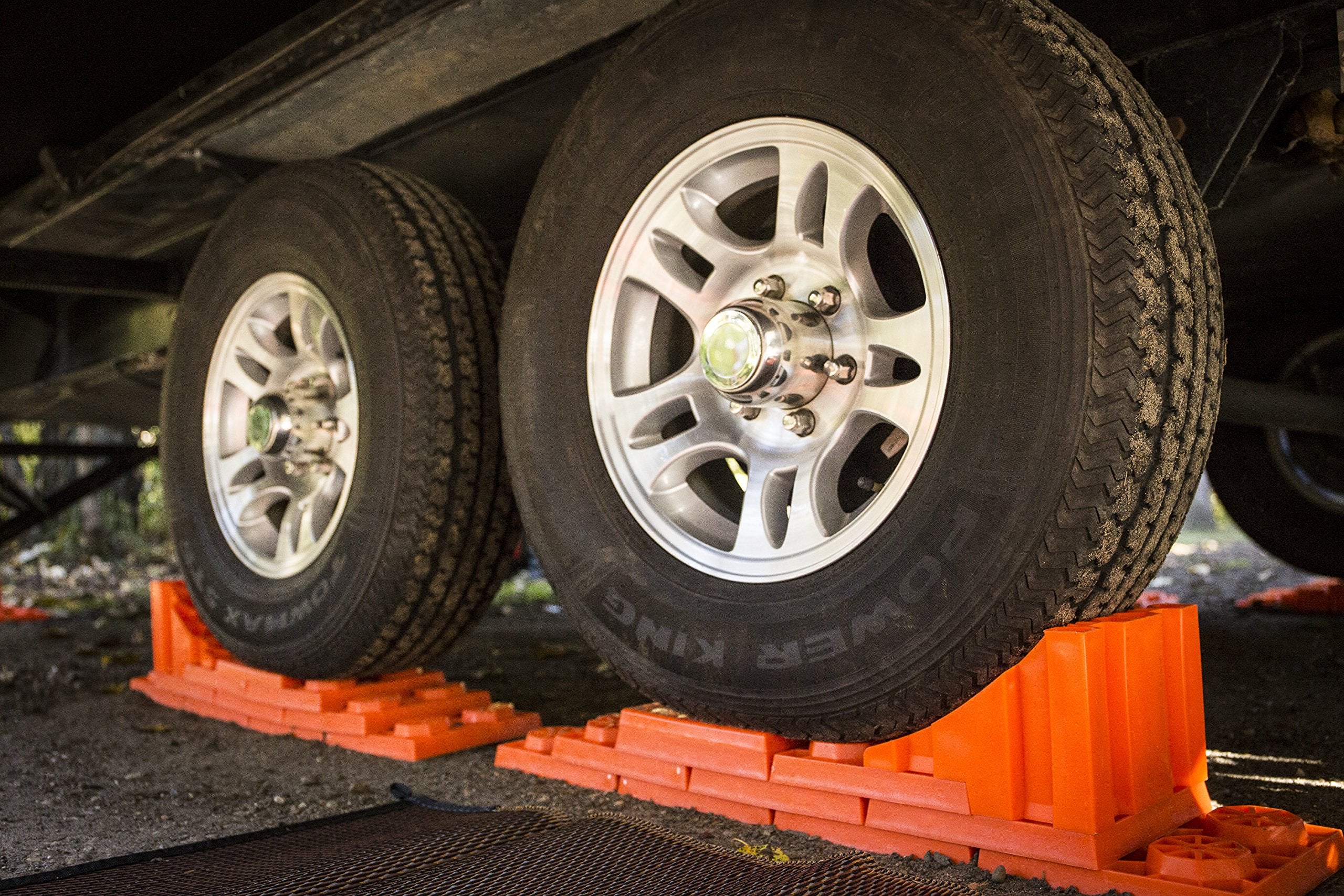 Tri-Lynx Stop N Chock keeps tires in place for precise leveling.