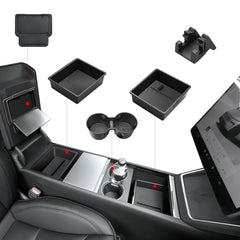 Under-armrest tray stores cables and small items neatly