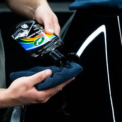 Turtle Wax Color Magic foam applicator spreading evenly for a professional finish.