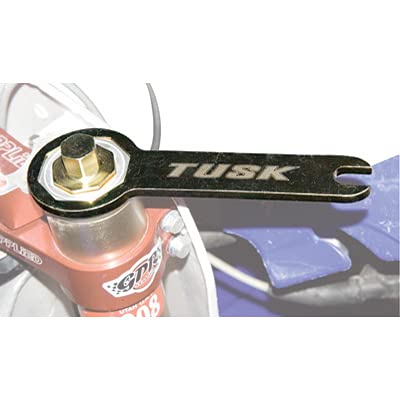 Tusk KYB dual-chamber fork cap wrench set in use for servicing.