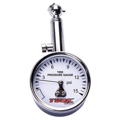 Tusk low-pressure dial tire gauge bleeder button closeup shows simple zeroing to hold readings.