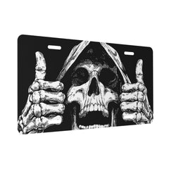 Twistmyst front license cover in black and white skull pattern adds bold style to your vehicle.