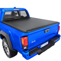 Tyger Auto T1 soft roll-up cover front view showing weather protection for Toyota Tacoma
