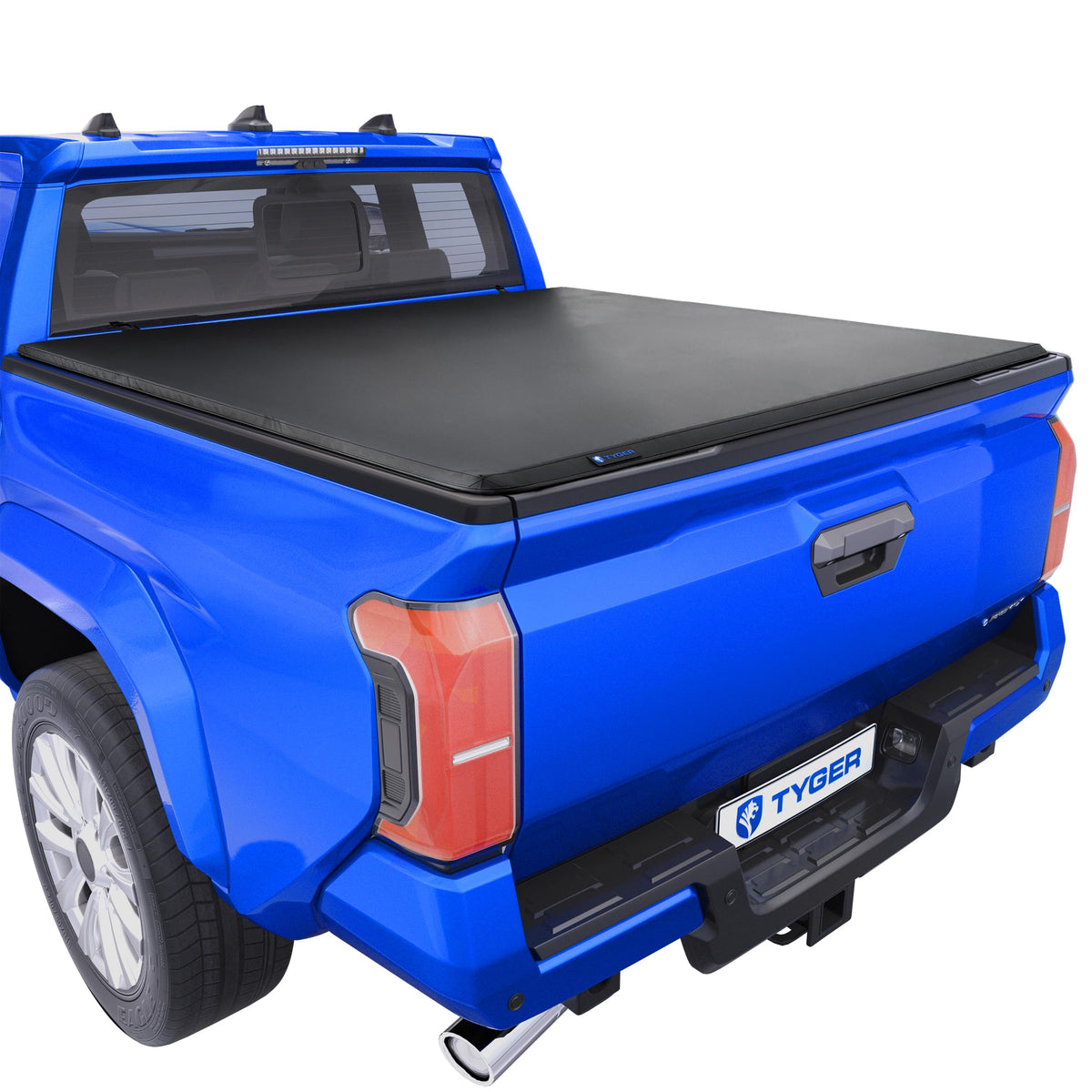 Tyger Auto T3 cover front view on Toyota Tacoma showing deck rail compatibility for secure cargo.