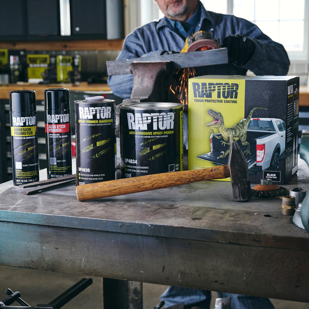 U-POL Raptor primer uses flat fan nozzle for even coverage across panels.