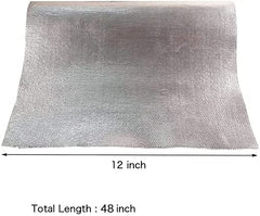 Ummickl heat barrier shown during adhesive-backed installation on a surface.