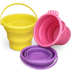 Umnodobn foldable bucket at the beach for kid-friendly sand play and easy cleanup.
