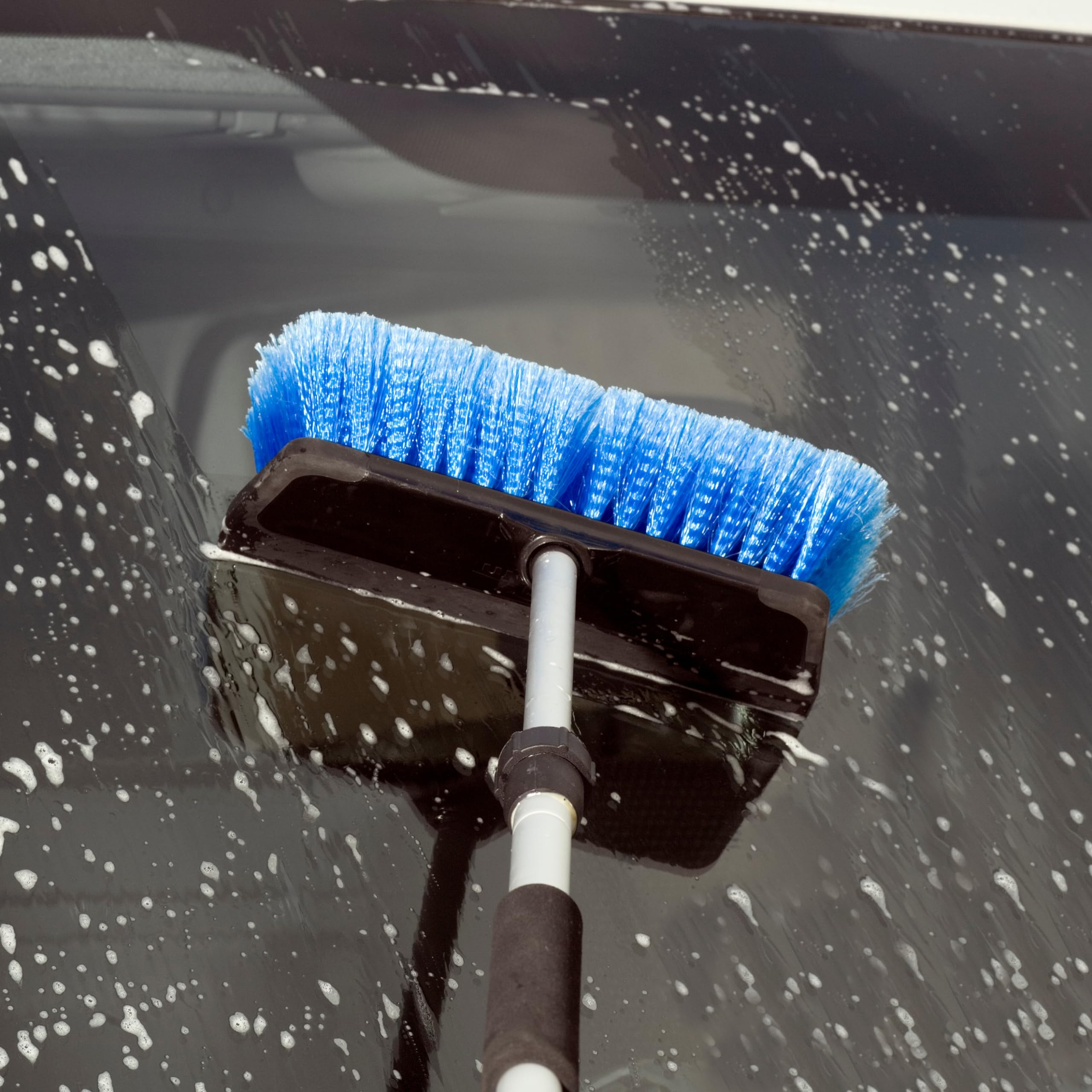 Pole-compatible HydroPower brush with water-flow capability for easier cleaning