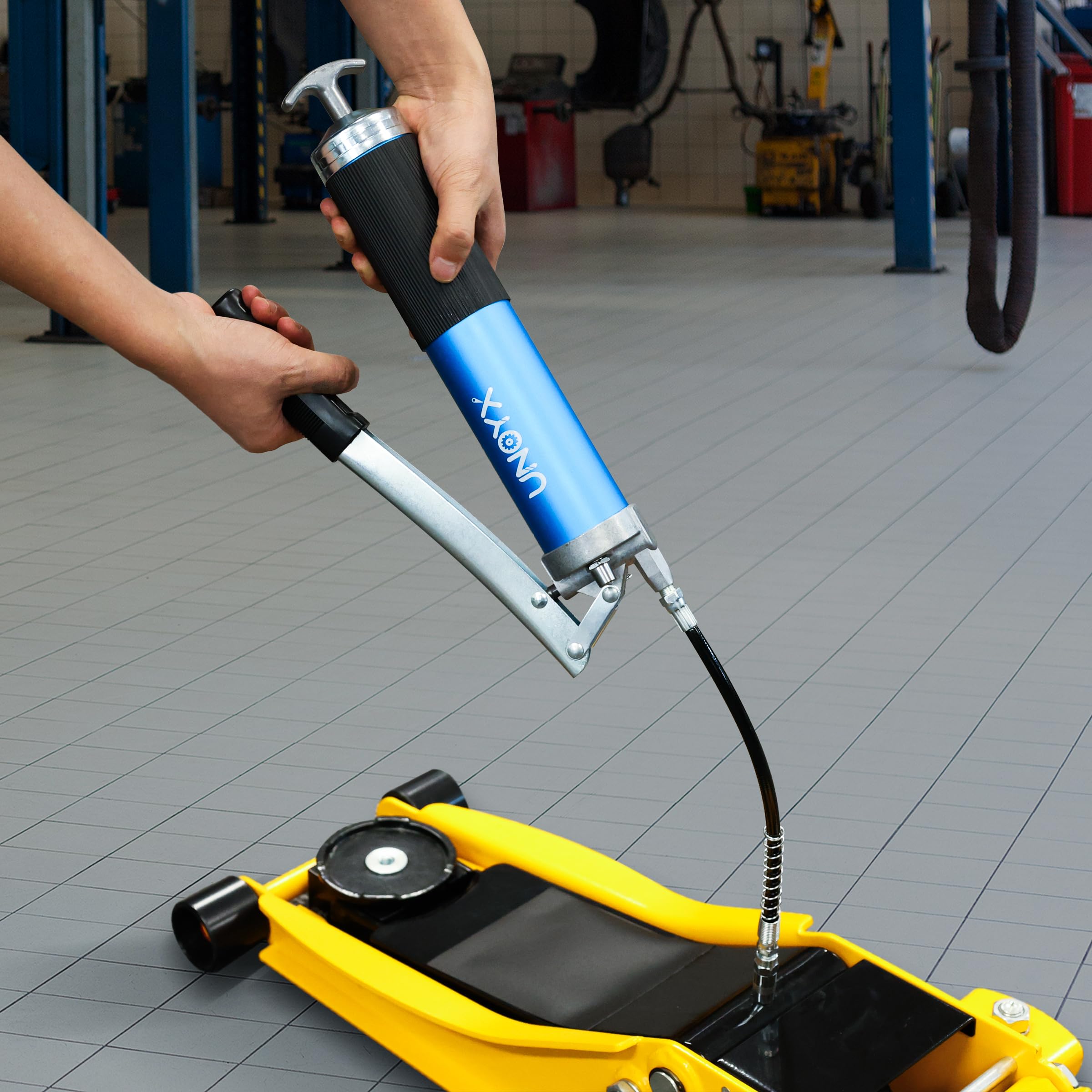 UNOYX complete grease gun kit including hose, coupler, and needle adapter.