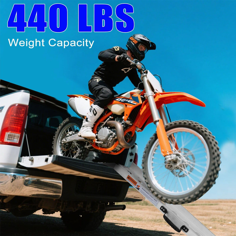 VENDAV ramp in use loading a motorcycle onto a pickup.
