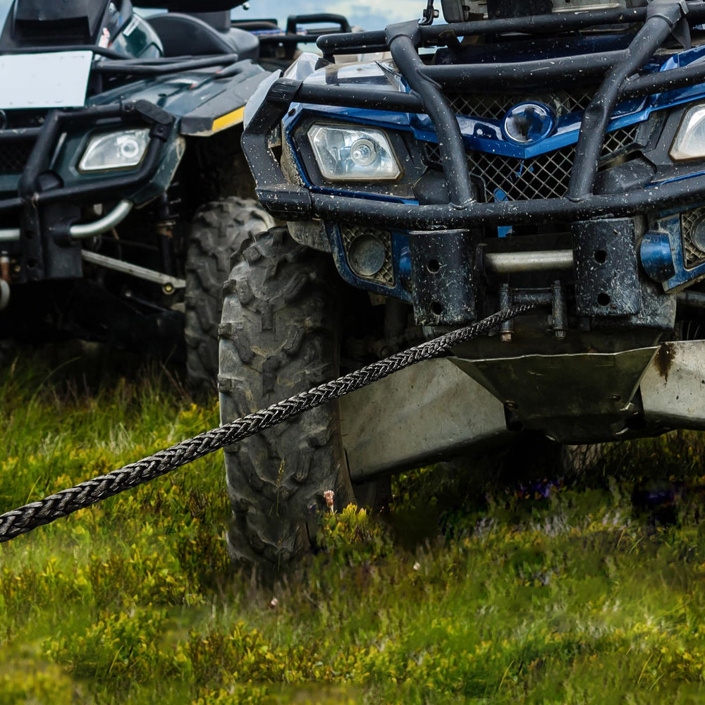 Off-road vehicle using the winch rope in rugged terrain demonstrates utility.