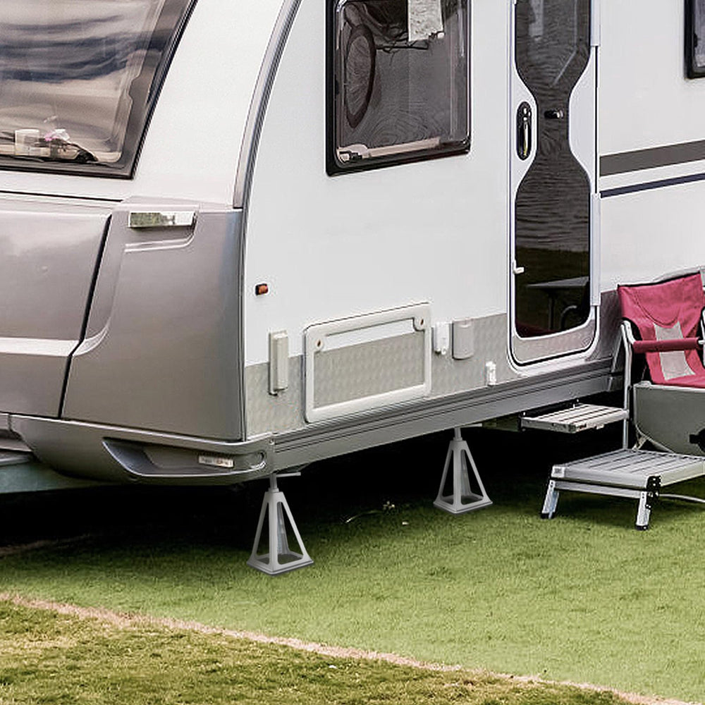 Soft ground setup with boards under jacks for extra stability.