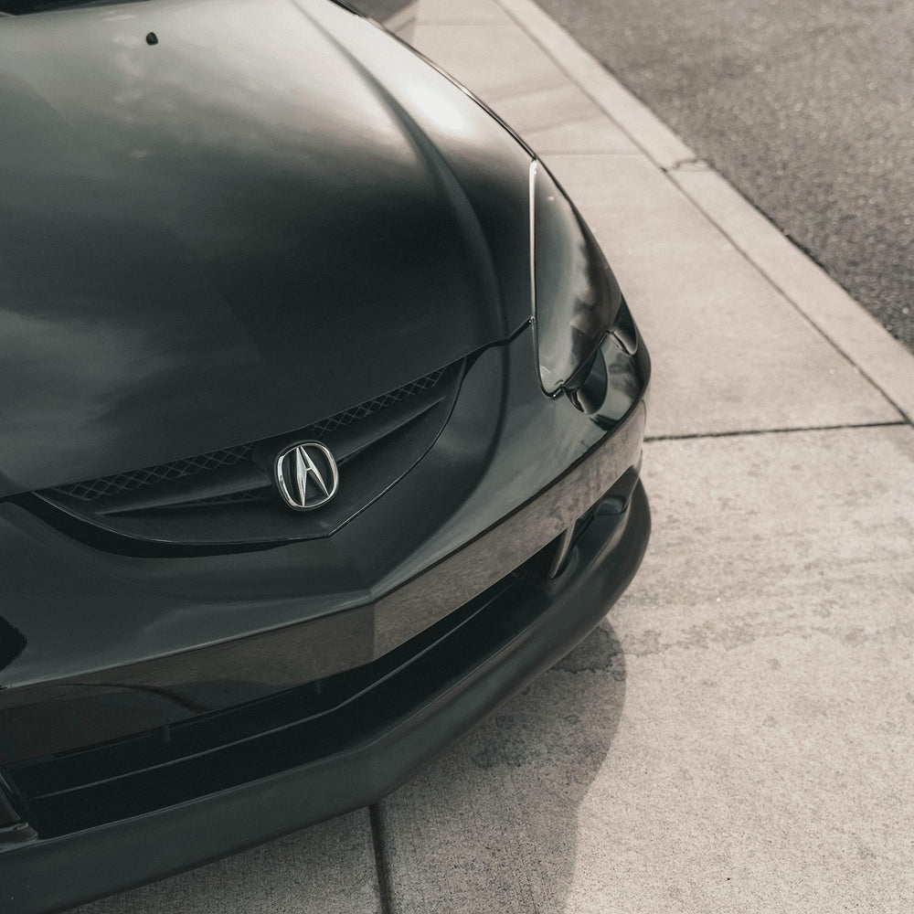 VViViD gloss black vinyl wrap demonstrates bubble-free adhesion during installation