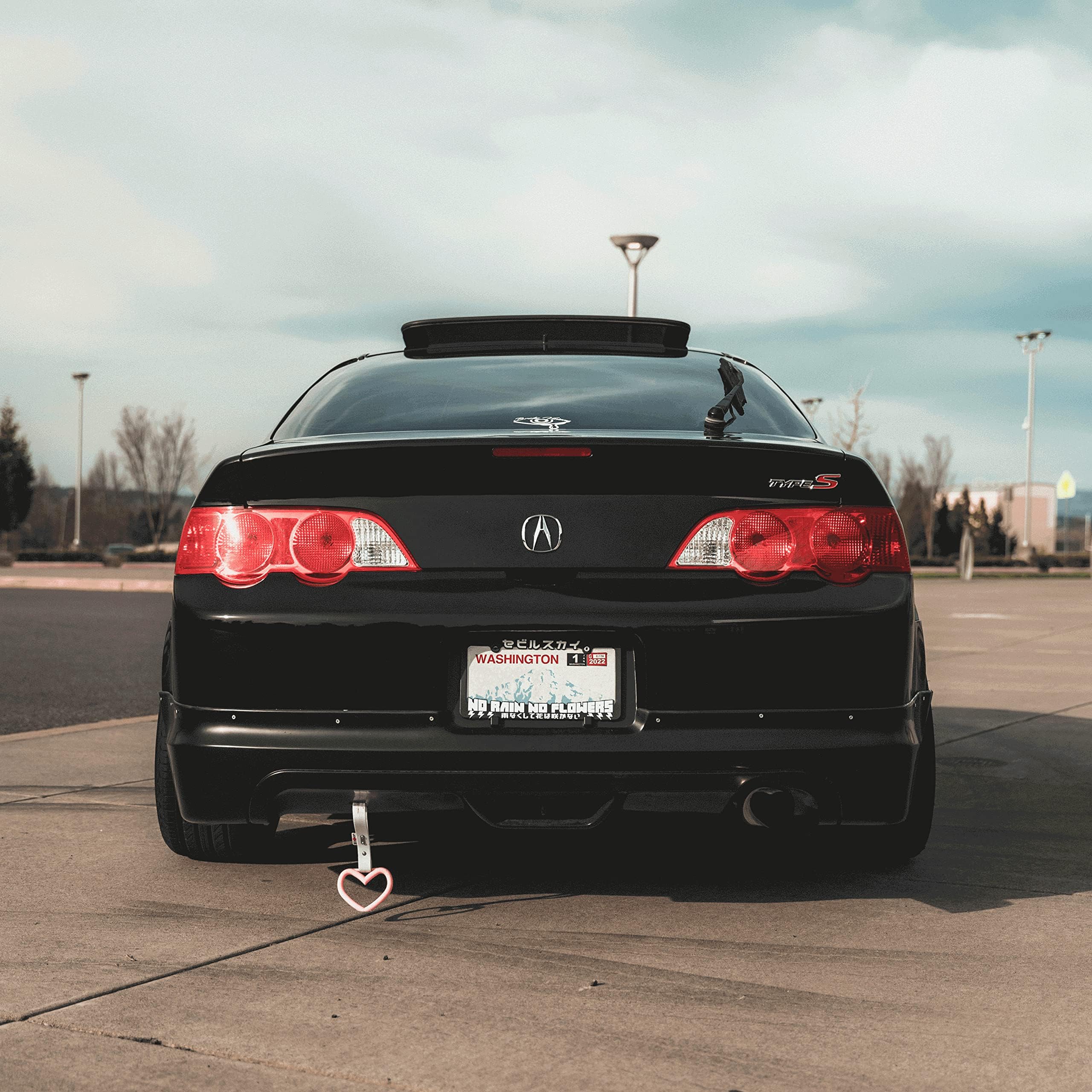 VViViD gloss black vinyl wrap stretches to fit curves for a smooth look