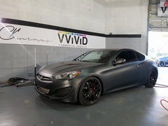 VVIVID+ matte metallic black wrap on curved panel showing seamless fit