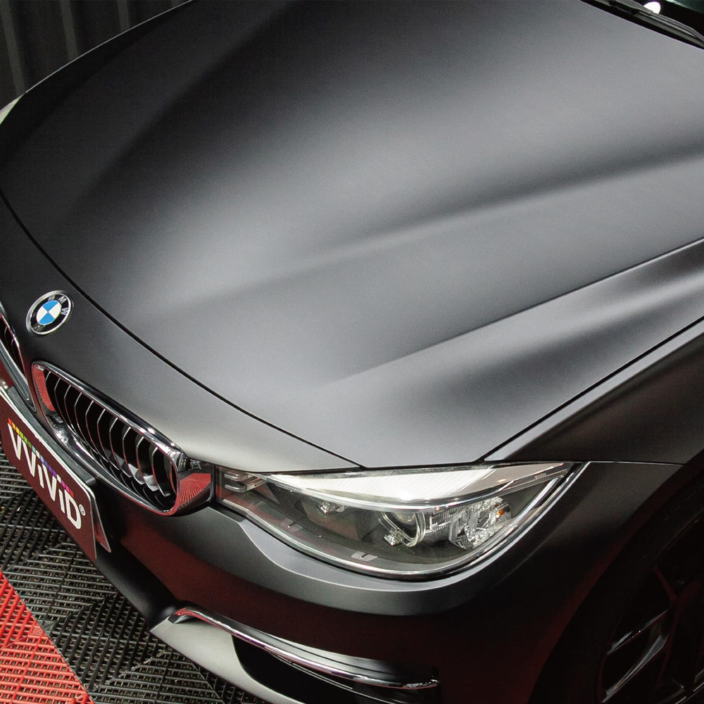VVIVID+ matte metallic black wrap demonstrating silk-like adhesive glide