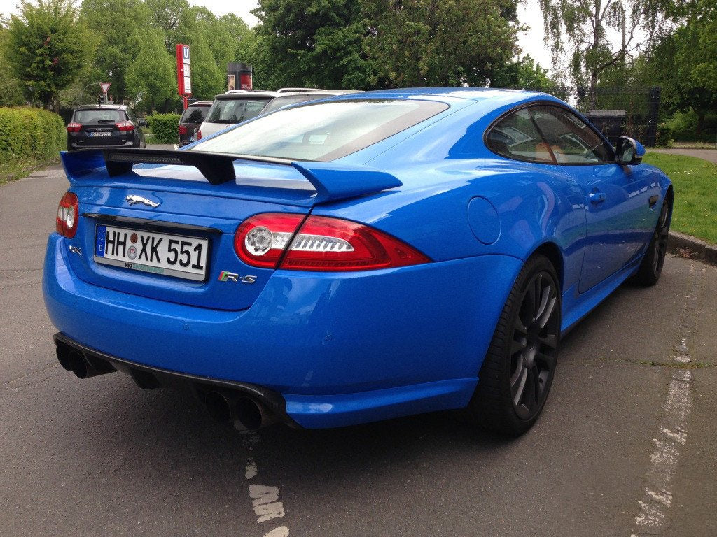 VViViD Smurf Blue gloss wrap on car demonstrates bold color with minimal bubbles.