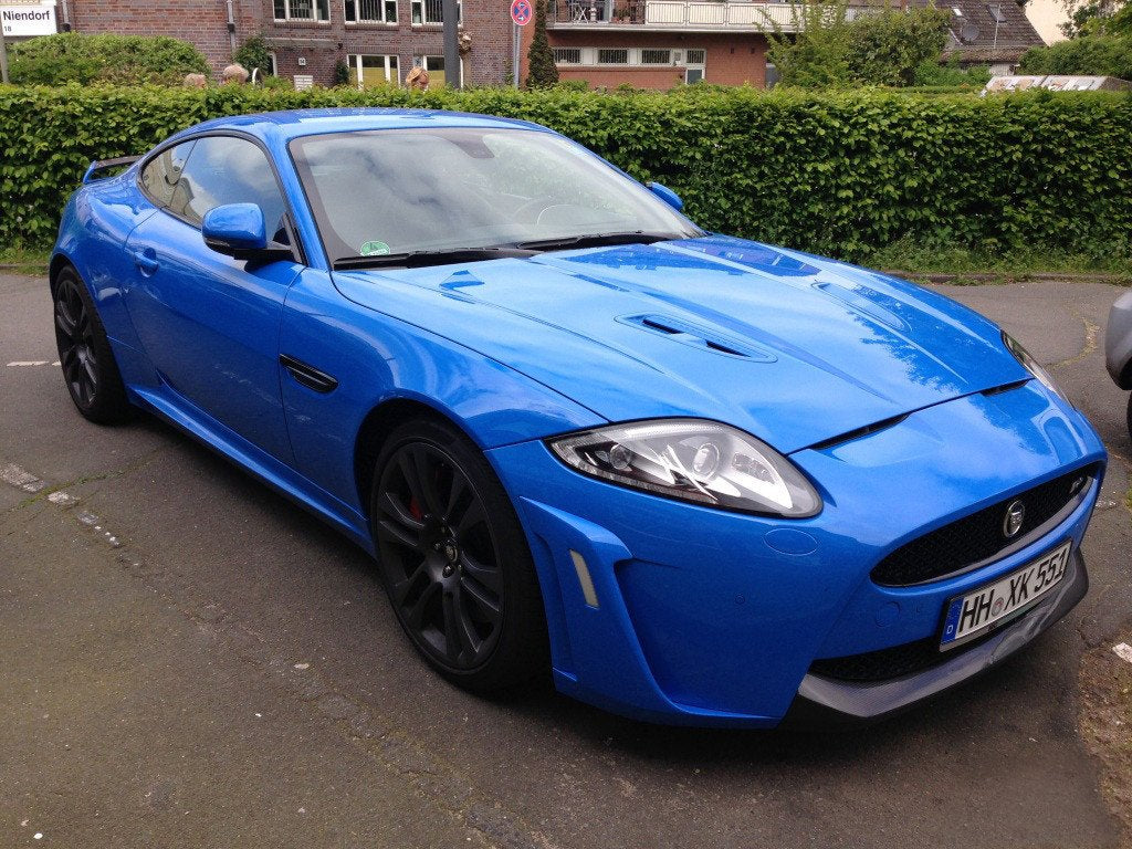 VViViD Smurf Blue gloss wrap shown with application tools for easy install via air-release backing.