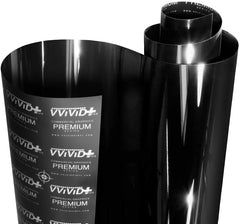 VViViD Ultra Gloss Piano Black wrap on a car panel with a mirror-like finish.