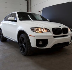 VViViD matte white wrap on a car panel highlighting conformability to curves.