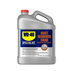 WD-40 Specialist Rust Remover Soak bottle pour demonstrates easy rust dissolution for metal tools.