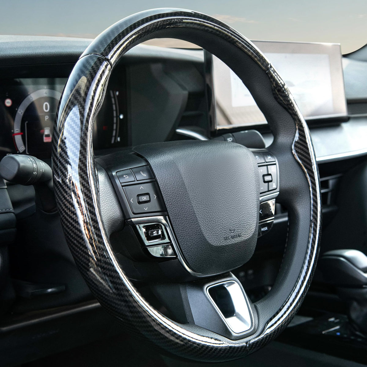 West Llama 3pc steering wheel cover glossy black close-up highlighting premium carbon-fiber texture.