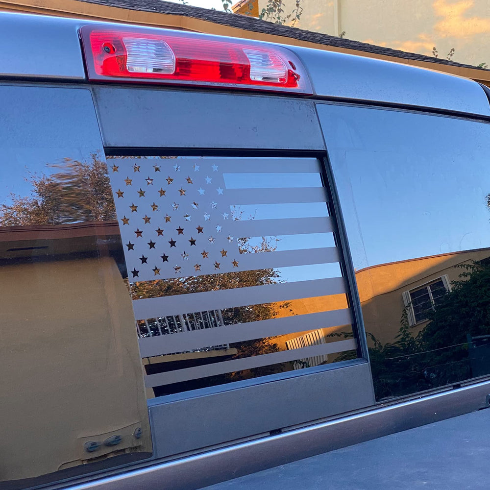 Xinghe American flag decal on Nissan Frontier back window for a bold look and privacy