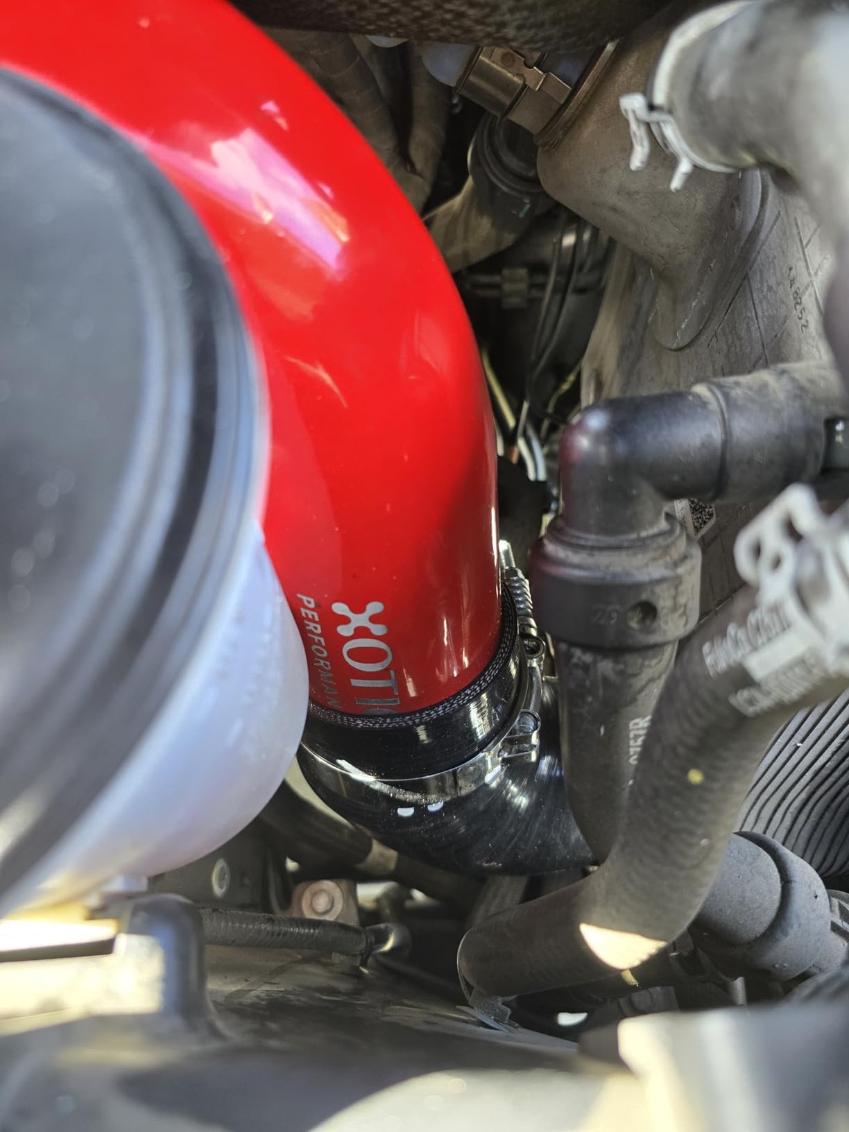 Xotic Performance stainless steel spring-loaded t-bolt clamps secure leak-free connections.