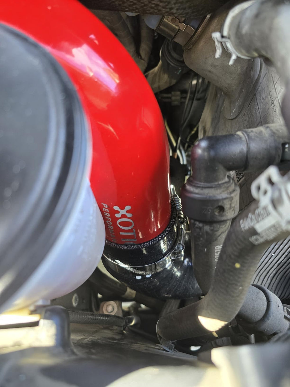 Xotic Performance stainless steel spring-loaded t-bolt clamps secure leak-free connections.