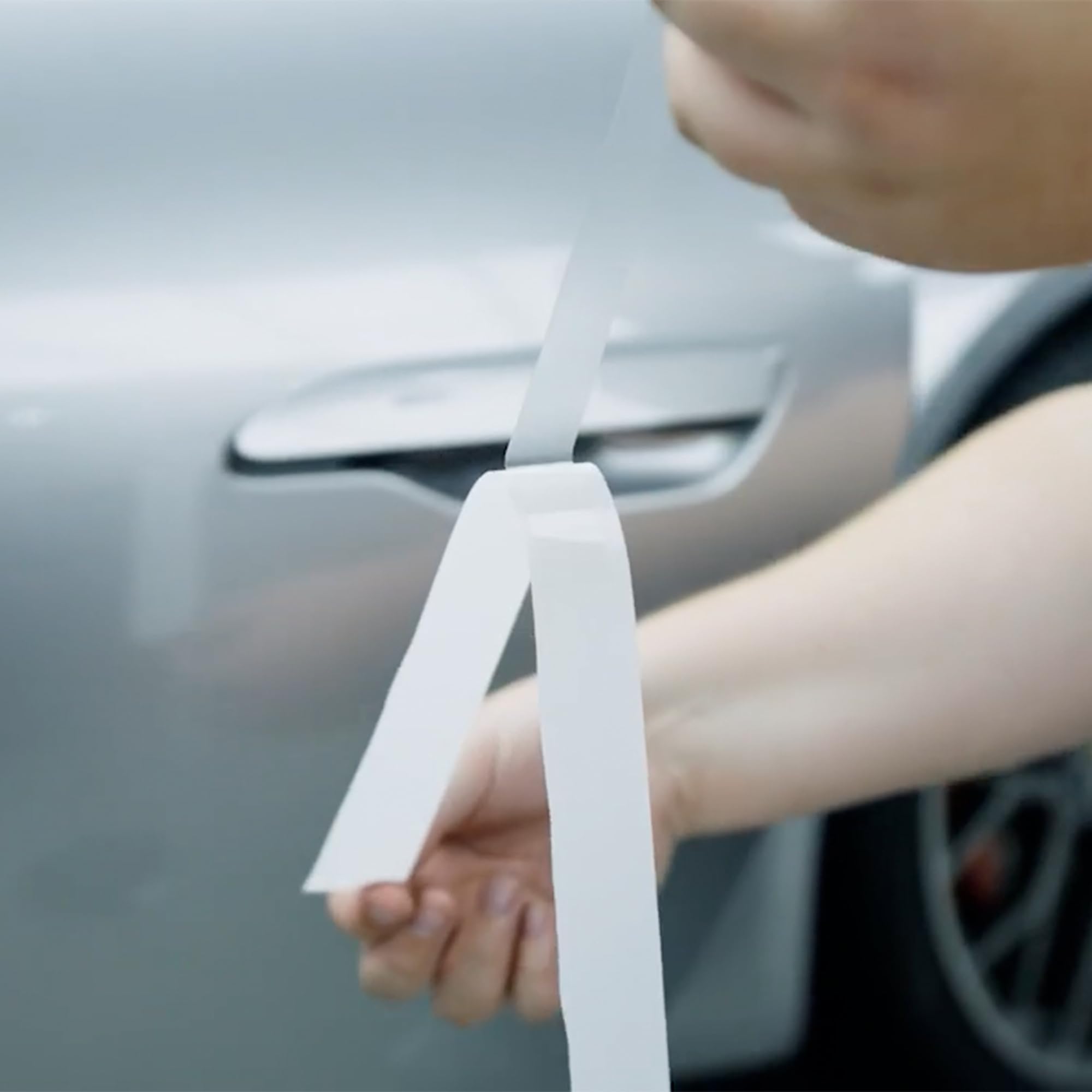 Applying XPEL Door Edge Guard along a car door edge