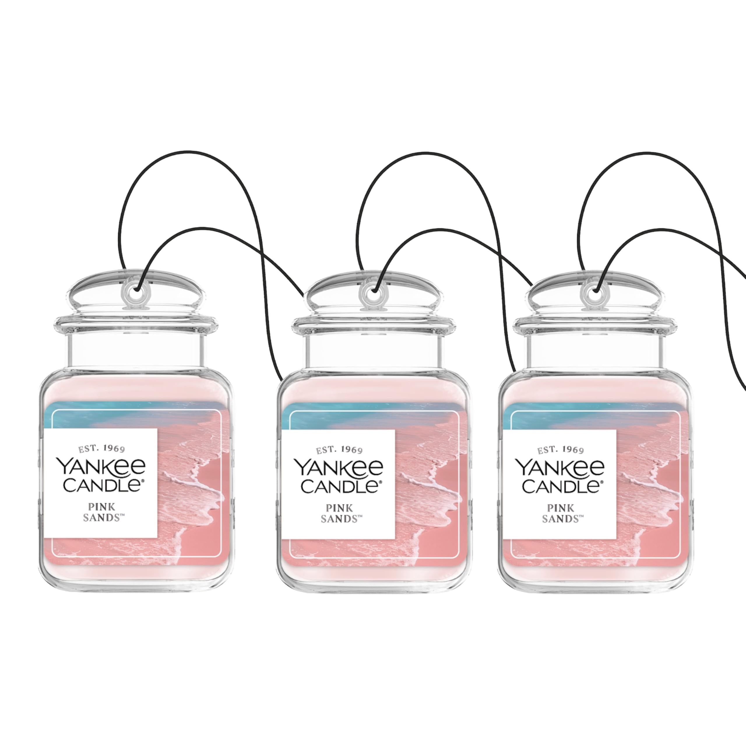 Yankee Candle Car Jar Ultimate Pink Sands hanging in car emitting citrus and floral notes