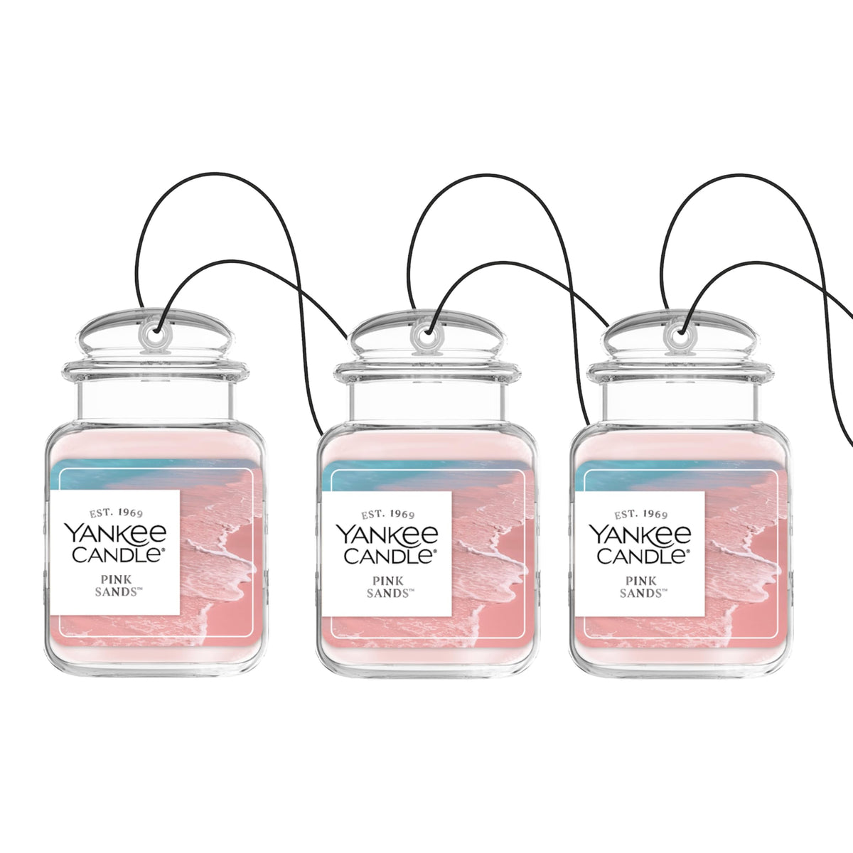 Yankee Candle Car Jar Ultimate Pink Sands hanging in car emitting citrus and floral notes