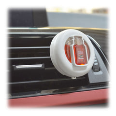 Yankee Candle Macintosh vent clips on a dash with clear window indicating replacement due.