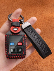YINEOR leather key fob cover held in hand highlights secure grip design.