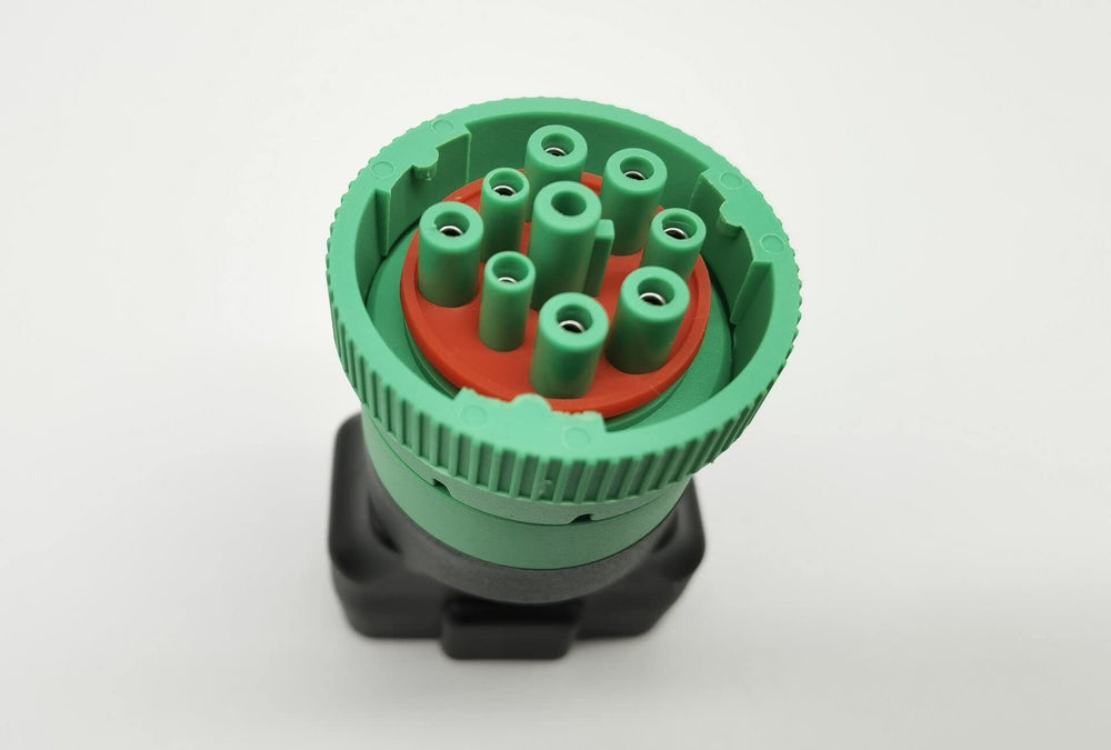 Green J1939 to OBD2 adapter ready for diagnostic scanners
